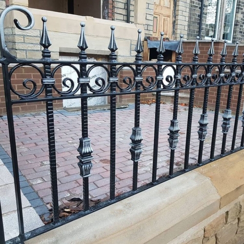 Wrought iron arrow fence