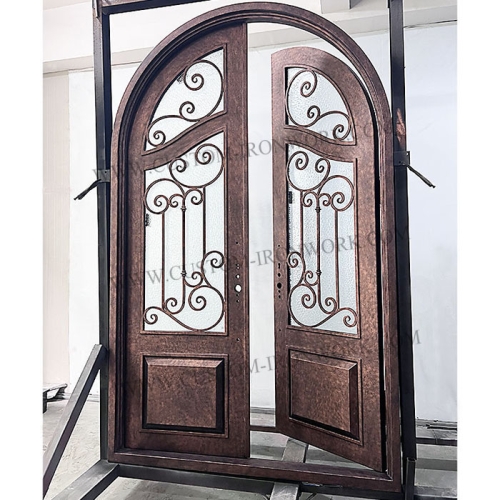 Antique wrought iron arch top entry door