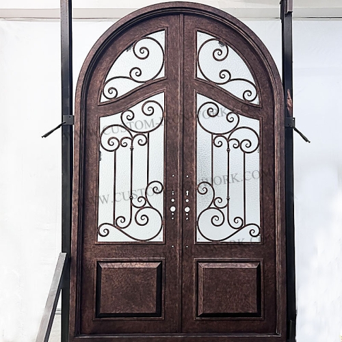 Antique wrought iron arch top entry door