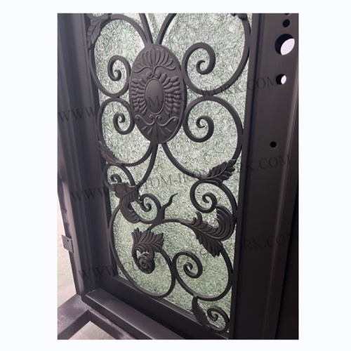 Hand-hammered iron door decorated entrance of house