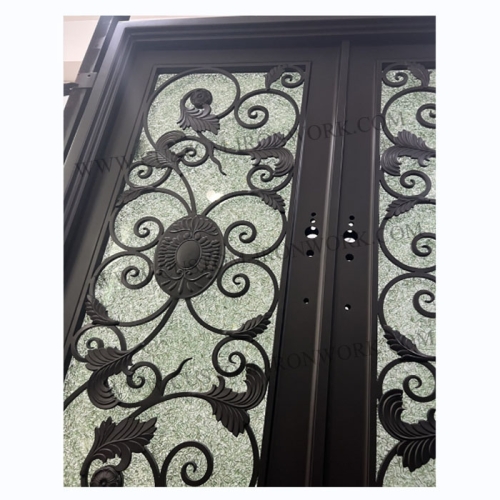 Hand-hammered iron door decorated entrance of house