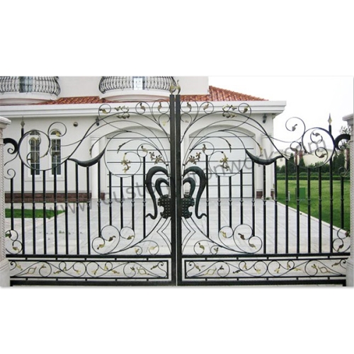 Hand-hammered iron gate decorated entrance of house