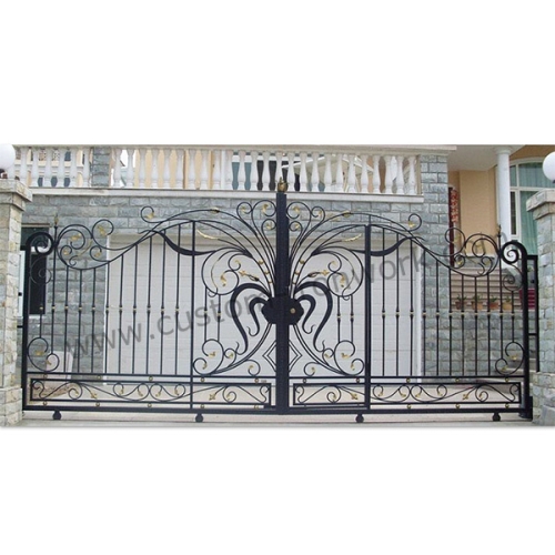 Hand-hammered iron gate decorated entrance of house