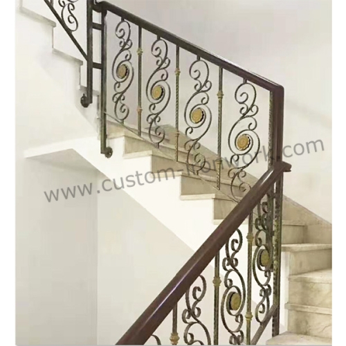 Hand-hammered iron handrail decorated of house
